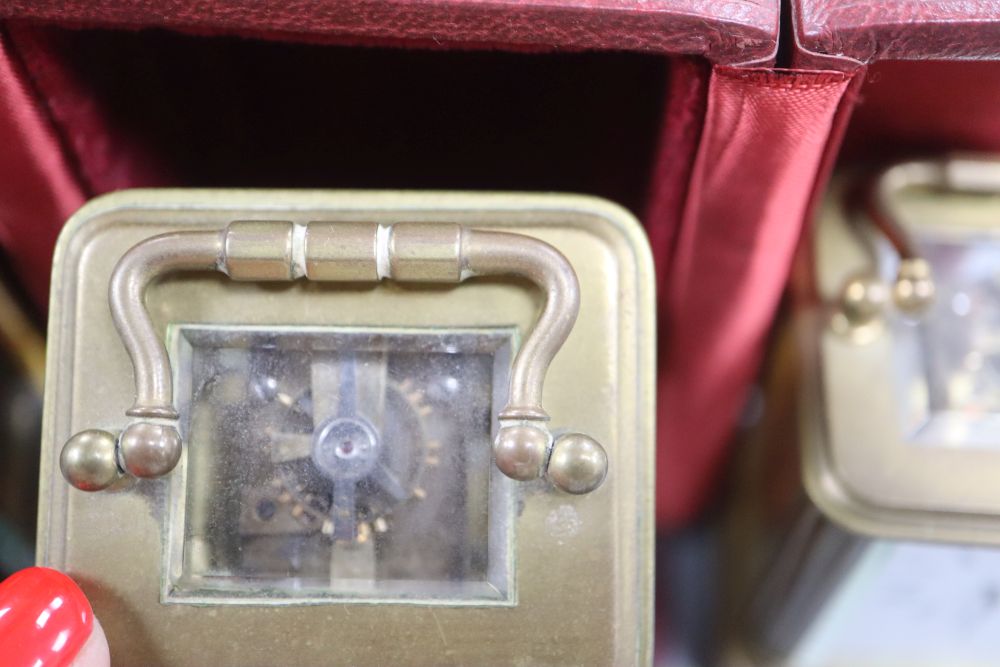 A cased lacquered brass miniature carriage timepiece and two others